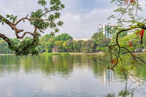 Hanoi, Vietnam - 26 June 2024 Turtle Tower Thap Rua in Hoan Kiem lake Sword lake, Ho Guom in Hanoi, Vietnam. photo