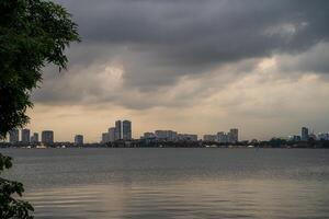 Hanoi, Vietnam - 25 Jun 2024 West Lake in Hanoi in the dark cloudy evening. Ha Noi cityscape. Travel concept photo