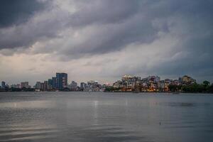 Hanoi, Vietnam - 25 Jun 2024 West Lake in Hanoi in the dark cloudy evening. Ha Noi cityscape. Travel concept photo