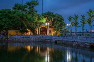 Hanoi, Vietnam - 25 Jun 2024 Tran Quoc Pagoda, the oldest Buddhist temple in Hanoi, is located on a small island near the southeastern shore of West Lake, Hanoi, Vietnam. photo