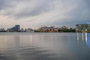 Hanoi, Vietnam - 25 Jun 2024 West Lake in Hanoi in the dark cloudy evening. Ha Noi cityscape. Travel concept photo