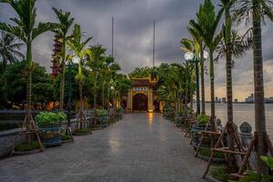 Hanoi, Vietnam - 25 Jun 2024 Tran Quoc Pagoda, the oldest Buddhist temple in Hanoi, is located on a small island near the southeastern shore of West Lake, Hanoi, Vietnam. photo