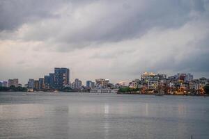 Hanoi, Vietnam - 25 Jun 2024 West Lake in Hanoi in the dark cloudy evening. Ha Noi cityscape. Travel concept photo