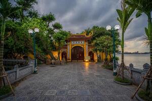 Hanoi, Vietnam - 25 Jun 2024 Tran Quoc Pagoda, the oldest Buddhist temple in Hanoi, is located on a small island near the southeastern shore of West Lake, Hanoi, Vietnam. photo