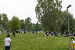 Stuttgart, Germany, 19 September 2023. A group of migrants from different countries are enjoying their weekend in Germany. People are relaxing in the park, having a barbecue and enjoying themselves. photo