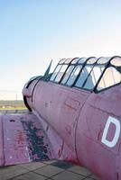 Model of an old airplane side view. Plane. North American AT-6A Texan. photo
