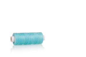 a skein of threads of blue color macro on a white background close up photo