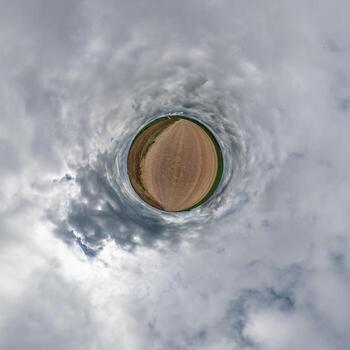 simple little tiny planet without buildings in blue sky with beautiful clouds. Transformation of spherical panorama 360 degrees. Spherical abstract aerial view. Curvature of space. photo