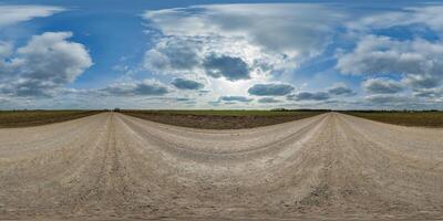 blue sky hdri 360 panorama with awesome clouds on gravel road among fields in spring day in equirectangular full seamless spherical projection, for VR AR content or skydome replacement photo