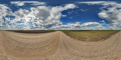 blue sky hdri 360 panorama with awesome clouds on gravel road among fields in spring day in equirectangular full seamless spherical projection, for VR AR content or skydome replacement photo