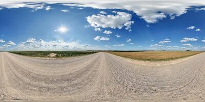 spherical 360 hdri panorama on side of gravel road with rain storm clouds in dark sky in equirectangular seamless projection, as skydome replacement in drone panoramas, game development photo