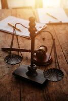 Judge gavel with Justice lawyers having team meeting at law firm background. Concepts of Law and Legal services. photo