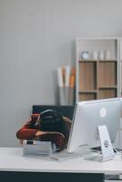 The business lady and the employee take a nap while working on the office desk. Working women are exhausted and sleeping on the table photo