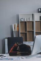 The business lady and the employee take a nap while working on the office desk. Working women are exhausted and sleeping on the table photo
