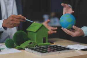 Green energy business company meeting with business people planning and discuss marketing of sustainable and renewable clean energy product with solar cell and wind turbine generator. Trailblazing photo
