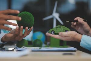 Green energy business company meeting with business people planning and discuss marketing of sustainable and renewable clean energy product with solar cell and wind turbine generator. Trailblazing photo
