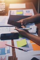 The designer team is designing the uxui system to make the uxui system work well on new phones and support system updates. Website development concept UI UX front end designer photo