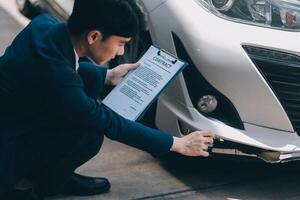 A young businesswoman is navigating car insurance options at her desk, considering premiums, deductibles, and coverage while understanding policies and managing claims efficiently. photo
