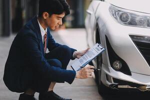A young businesswoman is navigating car insurance options at her desk, considering premiums, deductibles, and coverage while understanding policies and managing claims efficiently. photo