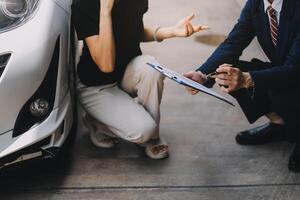 A young businesswoman is navigating car insurance options at her desk, considering premiums, deductibles, and coverage while understanding policies and managing claims efficiently. photo