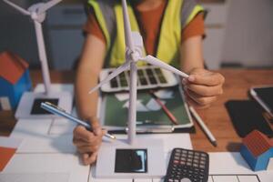 Female architect working at home She looked at the blueprint. photo