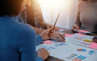 Team of business people working together in the meeting room office, teamwork background charts and graphs banner, double exposure successful teamwork,business planning concept. photo
