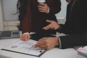 Audit concept,Administrator business man financial inspector and secretary making report calculating balance. Internal Revenue Service checking document. photo