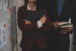 Audit concept,Administrator business man financial inspector and secretary making report calculating balance. Internal Revenue Service checking document. photo