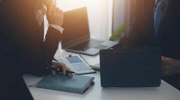 Audit concept,Administrator business man financial inspector and secretary making report calculating balance. Internal Revenue Service checking document. photo