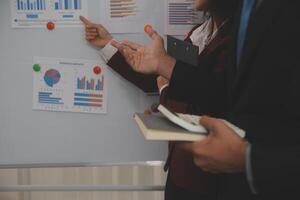 Audit concept,Administrator business man financial inspector and secretary making report calculating balance. Internal Revenue Service checking document. photo