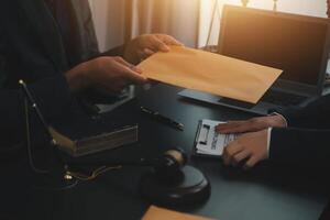 Law theme, gavel or mallet of the judge, lawyer enforcement officers, evidence-based cases taken into account in the court abount business, legislation. photo
