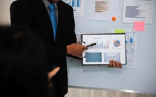 Audit concept,Administrator business man financial inspector and secretary making report calculating balance. Internal Revenue Service checking document. photo