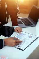 Audit concept,Administrator business man financial inspector and secretary making report calculating balance. Internal Revenue Service checking document. photo