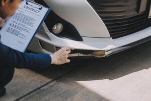 A young businesswoman is navigating car insurance options at her desk, considering premiums, deductibles, and coverage while understanding policies and managing claims efficiently. photo