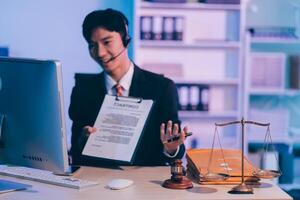 Judge gavel with Justice lawyers having team meeting at law firm background. Concepts of Law and Legal services. photo