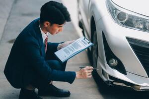 A young businesswoman is navigating car insurance options at her desk, considering premiums, deductibles, and coverage while understanding policies and managing claims efficiently. photo