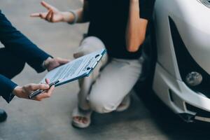 A young businesswoman is navigating car insurance options at her desk, considering premiums, deductibles, and coverage while understanding policies and managing claims efficiently. photo