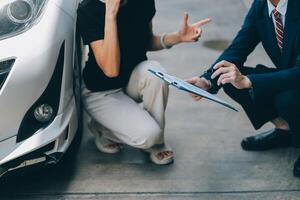A young businesswoman is navigating car insurance options at her desk, considering premiums, deductibles, and coverage while understanding policies and managing claims efficiently. photo