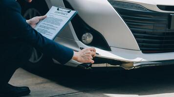 A young businesswoman is navigating car insurance options at her desk, considering premiums, deductibles, and coverage while understanding policies and managing claims efficiently. photo