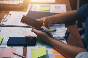 The designer team is designing the uxui system to make the uxui system work well on new phones and support system updates. Website development concept UI UX front end designer photo