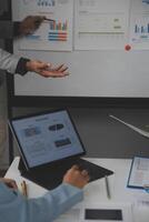 Close up of Business team analyzing income charts and graphs with modern laptop computer. Business analysis and strategy concept. photo