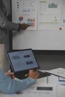 Close up of Business team analyzing income charts and graphs with modern laptop computer. Business analysis and strategy concept. photo