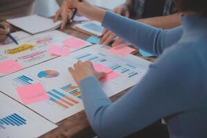 Team of business people working together in the meeting room office, teamwork background charts and graphs banner, double exposure successful teamwork,business planning concept. photo