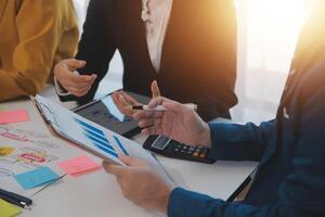 Meeting of business executives discussing analysis of the company's financial situation and business planning with partner collaboration and consultation of strategy. photo