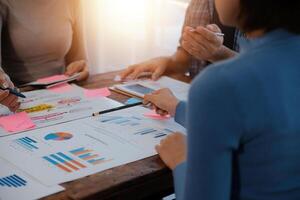 Team of business people working together in the meeting room office, teamwork background charts and graphs banner, double exposure successful teamwork,business planning concept. photo