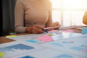 Team of business people working together in the meeting room office, teamwork background charts and graphs banner, double exposure successful teamwork,business planning concept. photo