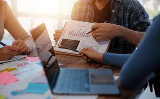 Team of business people working together in the meeting room office, teamwork background charts and graphs banner, double exposure successful teamwork,business planning concept. photo