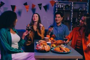 Joyful office Halloween party with coworkers in costumes, celebrating with drinks and laughter, fostering teamwork and festive spirit photo