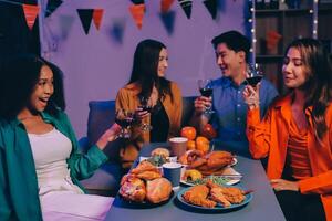 Joyful office Halloween party with coworkers in costumes, celebrating with drinks and laughter, fostering teamwork and festive spirit photo