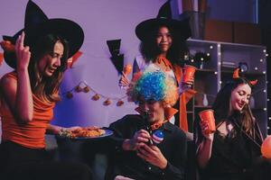 Joyful office Halloween party with coworkers in costumes, celebrating with drinks and laughter, fostering teamwork and festive spirit photo